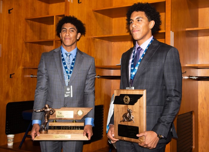 Summit Destin Wade holds the Class 6A Mr. Football award and Keaten Wade with the Mr. Football finalist, poses together in the Tennessee Titans locker room at Nissan Stadium in Nashville, Tenn., Tuesday, Dec. 7, 2021